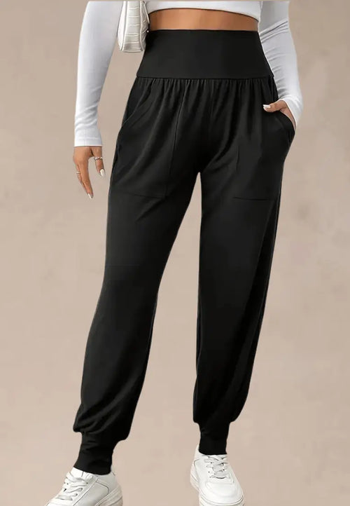 Czarne spodnie dresowe damskie z wysokim stanem i kieszeniami