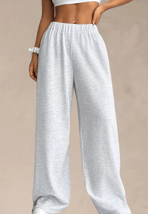 Szare spodnie dresowe damskie z szerokimi nogawkami i gumką w pasie