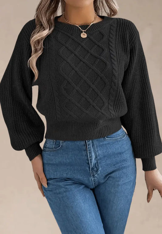 Czarny sweter damski z asymetrycznym wzorem