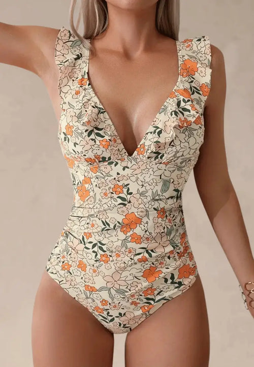 Kremowy strój kąpielowy jednoczęściowy damski w kwiaty z delikatną falbanką