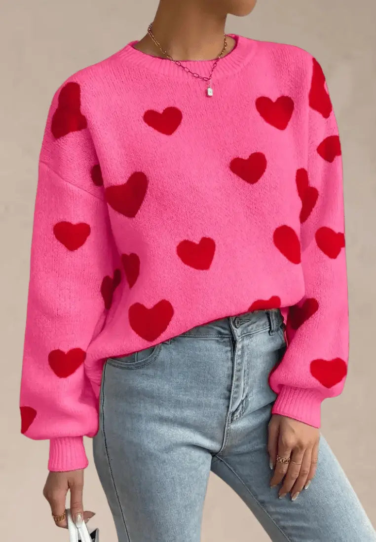 Różowy sweter damski z czerwonymi serduszkami