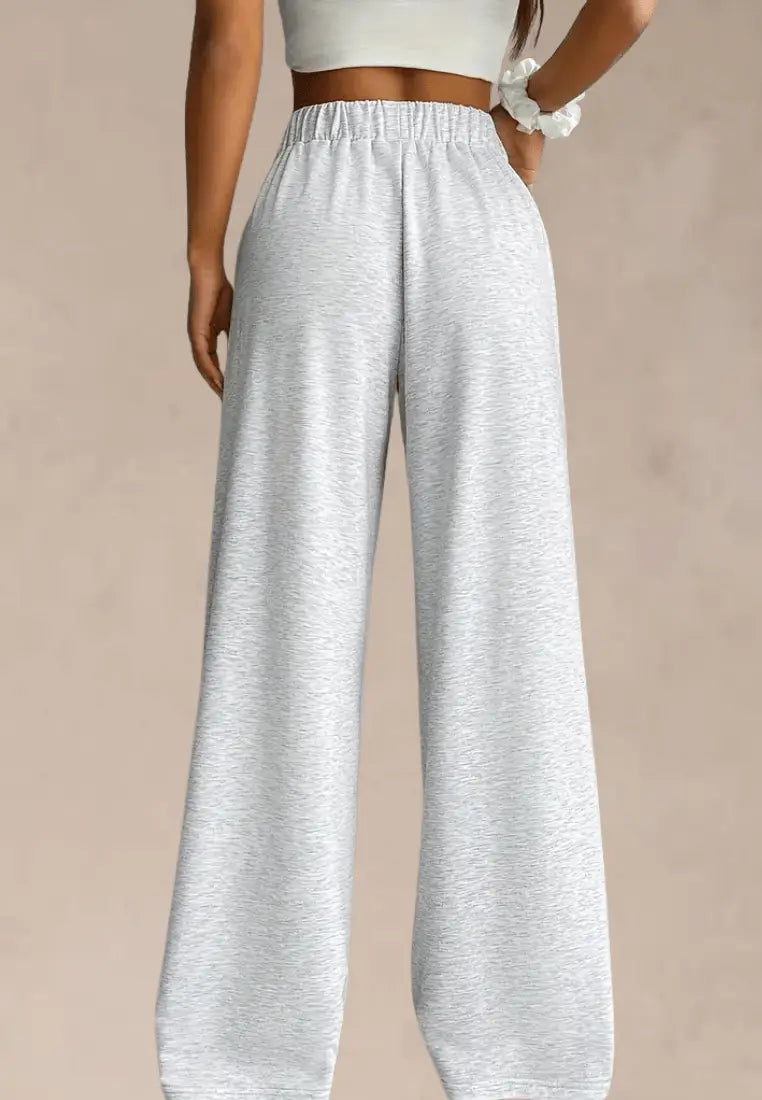 Szare spodnie dresowe damskie z szerokimi nogawkami i gumką w pasie