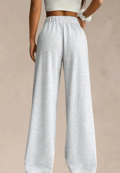 Szare spodnie dresowe damskie z szerokimi nogawkami i gumką w pasie