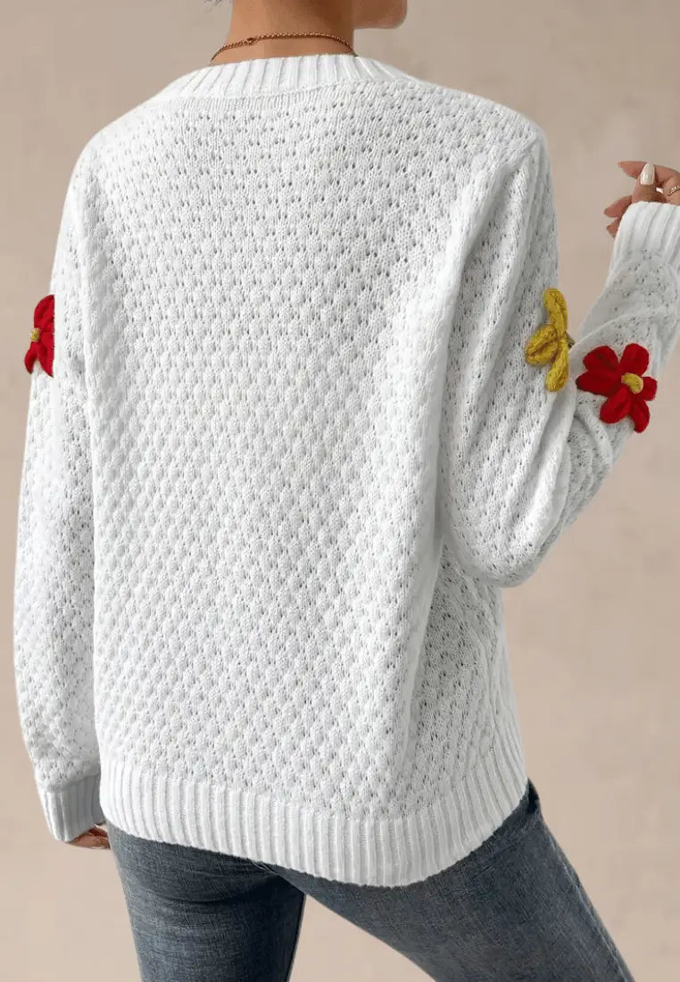Biały sweter damski z kolorowymi kwiatkami 3D i okrągłym dekoltem