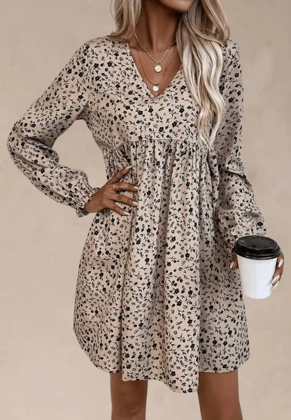 Beżowa sukienka w czarne kwiaty z dekoltem V i długim rękawem