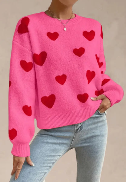 Różowy sweter damski z czerwonymi serduszkami