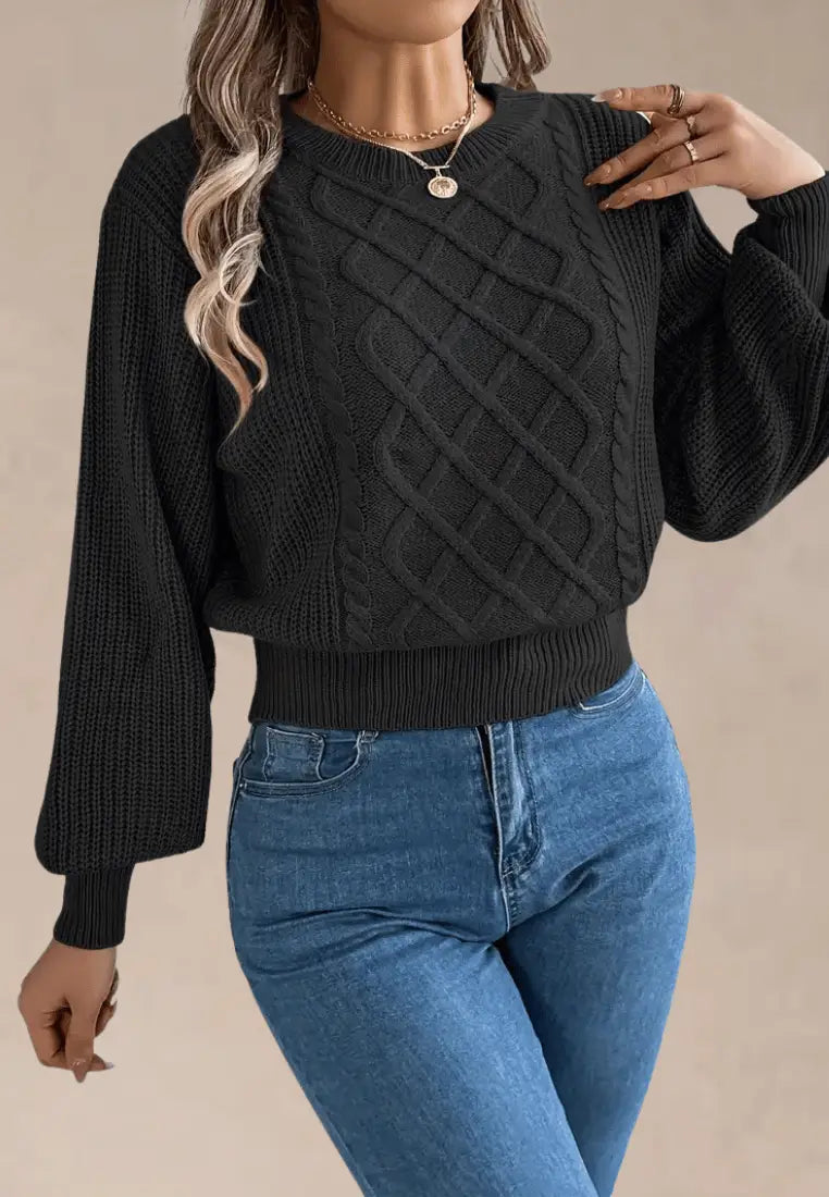 Czarny sweter damski z asymetrycznym wzorem