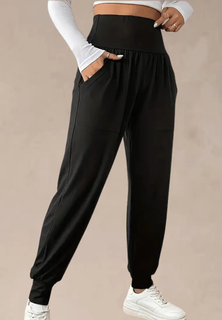 Czarne spodnie dresowe damskie z wysokim stanem i kieszeniami
